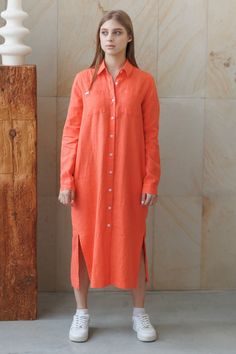 A cuff-length loose-fit linen shirt dress for women. Midaxi length, fastens with buttons at front. Long sleeves with buttons at cuffs. Two chest patch pockets. Straight hem with spacers. Yoke and decorative loop on the back. FEATURES Name: Leiria linen dress Color in the picture: coral Decor: plain Material: linen Collar: classic shirt Sleeve length: long  sleeve Fit: relaxed fit Features:  with pockets Season: summer Linen Shirt Dress With Button Cuffs For Work, Linen Button-up Midi Dress, Button-up Linen Midi Dress, Collared Linen Shirt Dress With Buttons, Linen Daywear Dress With Button Cuffs, Linen Long Sleeve Shirt Dress With Placket, Linen Button-up Shirt Dress With Buttons, Long Sleeve Linen Shirt Dress With Placket, Long Sleeve Linen Midi Dress With Buttons