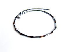 Classic beaded necklace for men made of tiger eye stone round bead and black hematite stone tube beads with stainless steel lobster clasp closure. Brown black necklace a great gift for him to create a stylish look. Necklace length: 19 inches (50 cm) Tiger eye stone beads: 4 mm Black hematite beads: 12 x 3 mm For all products are used only genuine high-quality Italian leather, natural stones and wood. All metal materials are lead and nickel free. /Gift wrapping and packaging/ : All items ordered Beaded Necklace For Men, Necklace Stones, Mens Necklace, Hematite Stone, Jewelry Care Instructions, Hematite Beads, Tiger Eye Stone, Mens Pendant, Eye Stone