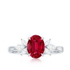 a ring with a large red stone surrounded by white diamonds