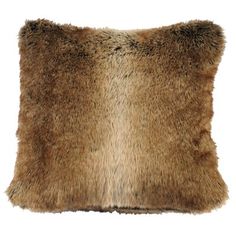 a brown and black fur pillow on a white background