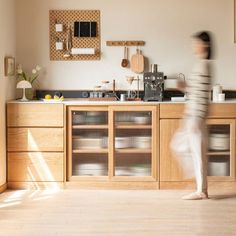 a blurry photo of a person in a kitchen