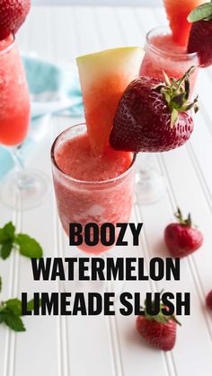 three glasses filled with watermelon and strawberries on top of a white table