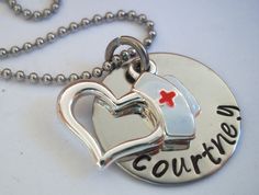 a silver necklace with a heart and nurse's cross on it that says, i love my courteen