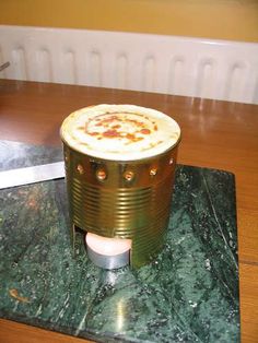 a stove top sitting on top of a green counter