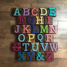 the letters are made out of wooden blocks