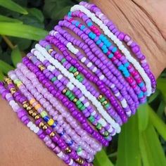 the bracelets are all different colors and sizes, but they have beads on them