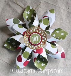 an origami flower with the word joy on it