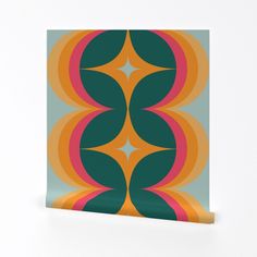 an orange, green and pink design on a white background