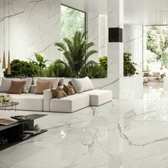 a living room with marble floors and white walls