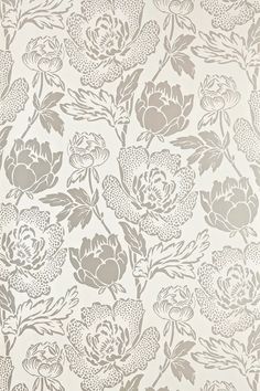 a white and grey floral wallpaper with large flowers on the back half of it