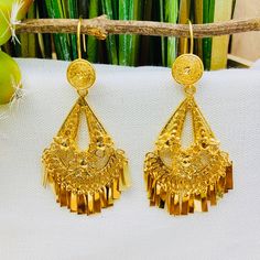 Beautiful and stunning handmade Mexican Filigree Earrings. Each piece is meticulously created out of copper wire and spun into a beautiful design. To give it the final touch artisans dipped into gold plate for it's gold color. This accessory is an important part of the traditional Tehuana outfit from Oaxaca, Mexico. Look elegant while wearing Mexico's culture with this one of a kind earrings! Approximate length: 3-3.5 in Need more than one? Ask us about our combined flat rate shipments for multi Ceremonial Drop Earrings, Ceremonial Chandelier Drop Earrings With Intricate Design, Ornate Ceremonial Drop Earrings, Ceremonial Intricate Chandelier Drop Earrings, Ceremonial Intricate Dangle Chandelier Earrings, Ceremonial Dangle Chandelier Earrings With Intricate Design, Ceremonial Pierced Gold-plated Earrings, Filigree Chandelier Drop Earrings For Festivals, Ceremonial Chandelier Dangle Earrings With Intricate Design