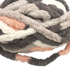 a close up of a ball of yarn on a white background