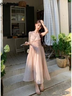 SPECIFICATIONSBrand Name: ezgagaElasticity: Slight StrechSleeve Style: TANKFabric Type: POLYESTERPattern Type: SolidFit Type: LOOSESilhouette: A-LINENeckline: HalterDecoration: RUFFLESStyle: CasualDresses Length: Mid-CalfMaterial: POLYESTERAge: JUNIOROrigin: Mainland ChinaCN: GuangdongSeason: SummerSleeve Length(cm): sleevelessGender: WOMEN Pink Chiffon Sleeveless Dress For Summer, Beige Sleeveless Ruffle Dress For Summer, Summer Chiffon Sleeveless Dress With Ruffles, Feminine Beige Sleeveless Summer Dress, Spring Sleeveless Chiffon Dress With Ruffles, Sleeveless Apricot Dress For Summer, Chiffon Sleeveless Dress With Ruffles For Spring, Spring Chiffon Sleeveless Dress With Ruffles, Beige Sleeveless Dress With Ruffles For Spring