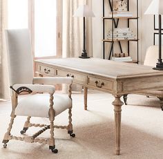 an old desk and chair in a room with white carpeted flooring, two lamps on either side of the table