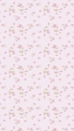 a pink wallpaper with small flowers on it