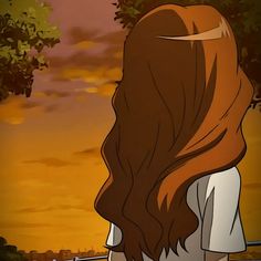 a girl with long brown hair standing in front of a tree and fence looking at the sunset