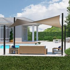 an outdoor area with a pool, lounge chairs and umbrellas in the foreground