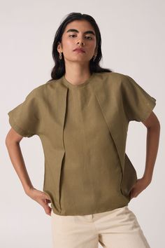 A linen-cotton top featuring a closed round neckline with front pleating detail. Drop sleeves. Back button fastening with a concealed placket. Ready Garment Measurements in Inches : XS S M L XL Bust 41 43 45 47 49 Hip 41 43 45 47 49 Length 23.5 23.75 24 24.25 24.5 Summer Jackets For Women, Pleat Sleeve, Olive Top, Pleated Sleeves, Summer Jacket, Signature Print, Linen Top, Cotton Top, Denim Outfit