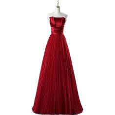 a red evening gown on a mannequin