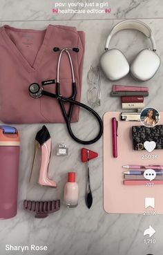 the contents of a woman's personal care kit laid out on a marble surface