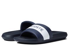 Lacoste Croco Slide 0721 1 - Men's Shoes : Navy White : Stay comfortable in the Lacoste Croco Slide 0721 1 featuring a classic slip-on style slide boasting branding center strap. Textile and synthetic upper. Textile lining. Synthetic insole and outsole. Imported. Measurements: Weight: 8 oz Product measurements were taken using size 9, width M. Please note that measurements may vary by size. Weight of footwear is based on a single item, not a pair. Classic Slip-on Synthetic Slides, Classic Synthetic Slip-on Slides, Classic Slip-on Beach Slides, Mens Lacoste, Bridal Lehenga Collection, Lehenga Collection, Hype Shoes, Ancient Greece, Bridal Lehenga