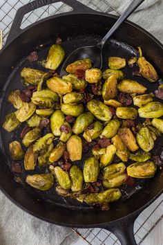 Caramelized Brussels sprouts with bacon in a cast iron pan with a large spoon. Caramelized Brussel Sprouts, Brussels Sprout Recipes, Pan Seared Chicken Thighs, Brussel Sprout Recipes, Brussels Sprouts With Bacon, Creamy Chicken And Rice, Bacon Brussel Sprouts