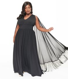 This gorgeous plus size black maxi dress is crafted in a black knit fabric and features adjustable cross back straps, and a dramatic attached cape with fringe accented hem..Available in sizes XS-4X while supplies last. | Smak Parlour Plus Size 1970S Black Fringe Cape Maxi Dress | Size 4X/22-24 Plus Size Black Maxi Dress, Fringe Cape, Outfit Wedding Guest, Plus Size Black, Plus Size Maxi, Black Fringe, Black Maxi, Comfortable Dress, Fashion Help