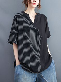 Summer Tops With Buttons And Asymmetrical Hem, Spring Tops With Buttons And Asymmetrical Hem, Spring Tops With Asymmetrical Hem And Buttons, Casual Black Blouse With Asymmetrical Hem, Spring Asymmetrical Tops With Buttons, Asymmetrical Summer Blouse With Buttons, Black Asymmetrical Top With Buttons, Asymmetrical Black Top With Buttons, Casual Asymmetrical Blouse For Work