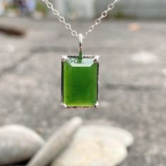 This Jade Necklace has a Natural Nephrite Jade Pendant. People believe that Green Stone Necklace is considered a necklace of luck. The Jade Necklace Silver is a suitable gift for a girl, a boy, or your best friend. Product Description - Gemstone: Natural Canadian Nephrite - Stone size: 9mm x 13.5mm x 4.5mm - Material: S925 Silver - Color: Light Green to Green. - Chain length: 18" - 20" adjustable (leave me a note if you need a longer chain). Jade Nephrite is a stone with a heart of healing, and Spiritual Rectangular Jade Jewelry, Jade Amulet Pendant Necklace, Green Gemstone Pendant Crystal Necklace, Green Amulet Pendant Necklace, Green Amulet Pendant Jewelry, Green Jade Pendant Crystal Necklace, Green Amulet Style Crystal Necklace For Gift, Handmade Green Necklaces With Rectangular Pendant, Handmade Green Necklace With Rectangular Pendant