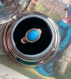 If you are a Jane Austen lover (like me!) or a lover of all things Georgian (also, like me!) then you are sure to swoon over this 'robin egg blue' Persian turquoise solitaire ring that is incredibly similar to Jane Austen's ring housed in Chawton UK, and which was, indeed, made in the same period as hers! Dating from the mid-1770s--the start of the Neoclassical aesthetic in Georgian era design of the 18th century--this ring may be understated in structure but the bright blue of the turquoise pac Vintage Oval Turquoise Ring For Formal Events, Vintage Oval Turquoise Ring For Formal Occasions, Antique Oval Turquoise Ring Hallmarked, Vintage Turquoise Gemstone Ring For Formal Occasions, Vintage Turquoise Ring For Formal Occasions, Antique Oval Turquoise Ring, Antique Turquoise Gemstone Ring For Formal Occasions, Turquoise Vintage Promise Ring, Antique Turquoise Anniversary Ring