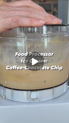 a person is pressing something into a blender to make ice cream coffee chocolate chip