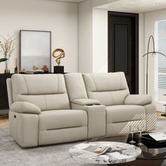 a living room scene with focus on the reclining sofa