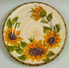 a plate with sunflowers painted on it