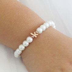 Personalized flower girl bracelet ,children's personalized pearl bracelet, flower girl gift , flower girl jewelry, wedding jewelry for kids. ♥Children's initial pearl bracelet on stretch cord. Available in ivory or white pearls and with a rhodium plated, 16k gold plated or rose gold plated lowercase initial. D E T A I L S ♥faux glass pearls 6mm ♥6mm rose gold plated, 16k gold plated or rhodium( silver) plated lowercase initial S I Z E ♥According to age ♥If you are unsure of the size please measu Elegant Personalized Rose Gold Beaded Bracelets, Elegant Personalized Rose Gold Beaded Bracelet, Personalized Adjustable Dainty Pearl Bracelet, Elegant Name Bracelet For Bridesmaid Gift, Personalized Rose Gold Charm Bracelet For Wedding, White Name Bracelet For Wedding, Elegant Initials Bracelets For Birthday, Elegant White Name Bracelet For Mother's Day, Elegant White Name Bracelet For Birthday