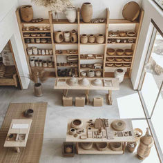 38 Modern Pottery Sanctuaries: Where Minimalism Fuels Artistic Expression Minimal Shop Interior, Clay Studio Aesthetic, Ceramic Home Studio, Aesthetic Pottery Studio, Ceramic Studio Layout, Artist Studio Workspaces, Pottery Shelves, Pottery Atelier