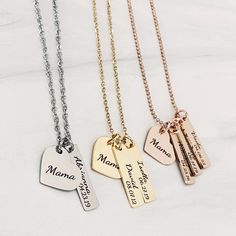 "A beautiful engraved heart necklace personalized with your children's names and their date of birth. Choose between multiple colors, chain styles, and lengths that fit your esthetic best. A family necklace that you'll never want to take off. Features: Your necklace will come packaged in a dainty blue organza bag perfect for gift-giving and storing. A beautiful heart charm pendant engraved with \"Mama\". Choose up to 4 rectangle charm tags that will be permanently laser engraved with your child' Momma Necklace, Engraved Heart Necklace, Necklace With Kids Names, Custom Bar Necklace, Engraving Ideas, Blue Organza, Body Types Women, Xmas 2024, Mama Necklace