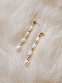 Simple enough to be worn everyday, but still incredibly chic. These earrings are the perfect addition to a polished look. Freshwater Pearls AAA Luster Pearls 14K Gold Filled Earring Length: 1.75" Please note - Freshwater Pearls & Gemstones are all natural and therefore unique, your Adorn Pili piece will be a one of one design. Pearl Earing Diy, Earring Photography, Diy Pearl Earrings, Pearl Lariat Necklace, Gold Bead Earrings, Freshwater Pearl Jewelry, One Of One, Easy Diy Jewelry, Earrings Inspiration