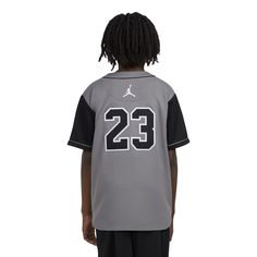 Baseball vibes with a basketball legacy. Showcase your love for both games in the Jordan HBR Baseball Jersey. Made with lightweight fabric, this jersey buttons down the front. It features heat-sealed Jordan and 23 logos on the front and back. Pair it with your AJ1s for a look worth posting on your socials. Button down jersey. Heat-sealed appliques logos at the front and back. Imported. Sporty Cotton Baseball Jersey With Team Logo, Casual Basketball Jersey With Team Logo, Sports Tops With Team Logo For Baseball Season, Varsity Jersey For Baseball Season, Athletic Heather Fan Apparel Top For Streetwear, Throwback Sports Season Tops With Team Logo, Casual Tops With Team Logo And Baseball Collar, Throwback Team Tops For Sports Events, Cotton Jersey For Streetwear With Team Spirit