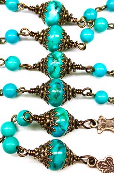 "TRUE BRONZE & GENUINE SINKIANG TURQUOISE ROSARY: 21 Inches Long Your beautiful rosary is made to last a lifetime and become an heirloom for your family. It will come nicely packaged in an organza pouch with a \"How To Pray The Rosary\" pamphlet included. Please remember to have your priest bless your rosary. Materials Used: Genuine Sinkiang Turquoise 6mm Beads, 12mm Turquoise Jasper Rondelle Beads as Paters, True Bronze 2 Inch Crucifix, True Bronze 1.75 Inch Mother Mary/Immaculate Heart Cen Turquoise Spacer Beads For Healing, Spiritual Turquoise Necklace With Spacer Beads, Turquoise Healing Spacer Beads, Healing Turquoise Spacer Beads, Spiritual Turquoise Beaded Bracelets For Jewelry Making, Turquoise 8mm Beads For Jewelry Making, Turquoise Rosary With Round Beads, Spiritual Turquoise Rosary With Round Beads, Turquoise Round Beads For Jewelry Making