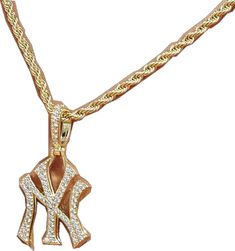 a gold necklace with an elephant charm on it's side and a diamond pendant hanging from the bottom