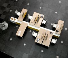 an overhead view of several tables and chairs in a room with black tile flooring