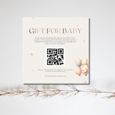 a gift for baby card with balloons and stars on the front, next to a plant