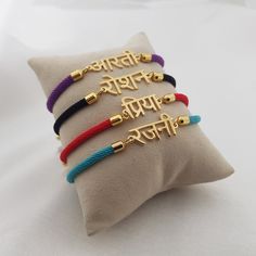 𝐻𝑜𝓌 𝒯𝑜 𝒪𝓇𝒹𝑒𝓇 - Choose cord color. - Leave the name/word in the personalization box in Hindi letters only. - You can use a virtual keyboard:  https://www.lexilogos.com/keyboard/devanagari.htm - Up to 11 characters. 𝐼𝓉𝑒𝓂 𝒟𝑒𝓈𝒸𝓇𝒾𝓅𝓉𝒾𝑜𝓃 Hindi Name Bracelet. Name dimensions: height: 7-9mm, width 15-35mm. Bracelet length: adjustable up to 7". 𝒪𝓇𝒹𝑒𝓇 𝐻𝒶𝓃𝒹𝓁𝒾𝓃𝑔 𝒯𝒾𝓂𝑒 Order processing time for our items is 3-5 business days, please note it does not include the deliver Personalized Multicolor Braided Bracelets As Gift, Multicolor Name Bracelet For Gifts, Multicolor Personalized Braided Bracelet For Gift, Personalized Adjustable Bracelets For Personal Use, Hindi Letters, Nameplate Bracelet, Spell Your Name, Bracelet Name, Virtual Keyboard