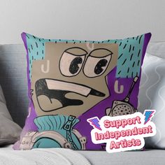 a pillow with the words support independent artists on it and an image of a cartoon character