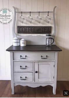 an old dresser has coffee cups on it