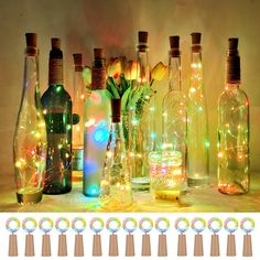 there are many bottles with lights in them