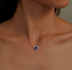 Elegant and sophisticated. This halo heart necklace features a blue lab-grown sapphire center stone surrounded by Lafonn's signature Lassaire simulated diamonds. The necklace is set in sterling silver bonded with platinum. Lab-grown sapphires have the exact same chemical, mineral, and optical properties as natural sapphires which vary in color, texture and pattern. We make every effort to keep our lab-grown sapphire stone colors consistent. However, all lab-grown sapphires may not be exactly as Sapphire Stone, Natural Sapphire, Heart Necklace, Lab Grown, Stone Color, Halo, Platinum, Sapphire, Lab