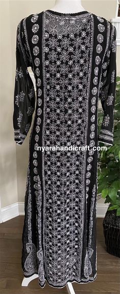 Gorgeously hand embroidered georgette Anarkali with side slits. Resham thread heavy embroidery back and front! Beautiful craftsmanship, neatly embroidered. Anarkali Length : 51-52inches Black Salwar Kameez With Floral Embroidery For Navratri, Black Chanderi Kurta With Floral Embroidery, Black Chanderi Fabric With Chikankari Embroidery, Embroidered Long Anarkali Kurta, Long Embroidered Anarkali Kurta, Anarkali Embroidered Long Kurta, Black Georgette Fabric With Chikankari Embroidery, Long Georgette Kurta With Intricate Embroidery, Black Embroidered Georgette Kurta