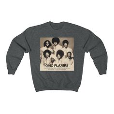 This a Gildan 18000 Unisex Heavy Blend Crewneck Sweatshirt. Featuring a graphic print of iconic 1970s Funk, Soul, Rock, and Pop music legends, Ohio Players. This loose-fit, aesthetic sweatshirt would be an ideal gift for R&B, Soul, Funk, Disco, Motown, 70s and 80s Rock and Pop and Jazz music fans, music lovers and band teachers, and a great addition to music lovers band t-shirt collections. Share the BLM and equal rights message in a positive way. This soft sweatshirt has a loose fit for a c Ohio Players, Fit Aesthetic, Band Teacher, Funk Pop, Aesthetic Sweatshirt, Band Tee Shirts, 80s Rock, Soul Funk, Bella Canvas Tees