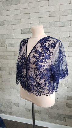 Beautiful and exquisite navy blue lace wedding topper - a truly elegant and unique adding to your bridal gown.  For more wedding tops and boleros, please access https://www.etsy.com/shop/LidiasBoutiqueDesign?ref=seller-platform-mcnav§ion_id=23157300.  For more wedding dresses, please access https://www.etsy.com/shop/LidiasBoutiqueDesign?ref=seller-platform-mcnav§ion_id=23157290.  For more wedding skirts, please access https://www.etsy.com/shop/LidiasBoutiqueDesign?ref=seller-platform-mcnav§ion_id=23168823.  We also recommend our hair bridal accessories https://www.etsy.com/shop/LidiasBoutiqueDesign?ref=seller-platform-mcnav§ion_id=23486819 and our wedding sashes and belts https://www.etsy.com/shop/LidiasBoutiqueDesign?ref=seller-platform-mcnav§ion_id=23425051. For more flower girls dresses Wedding Skirts, Wedding Tops, Bridesmaid Tops, Lace Bolero, Wedding Skirt, Wedding Cape, Sequin Wedding, Blue Sparkle, Sparkle Wedding